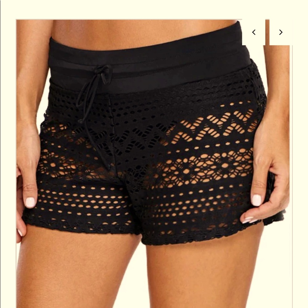 New, never worn, black side slit swim shorts